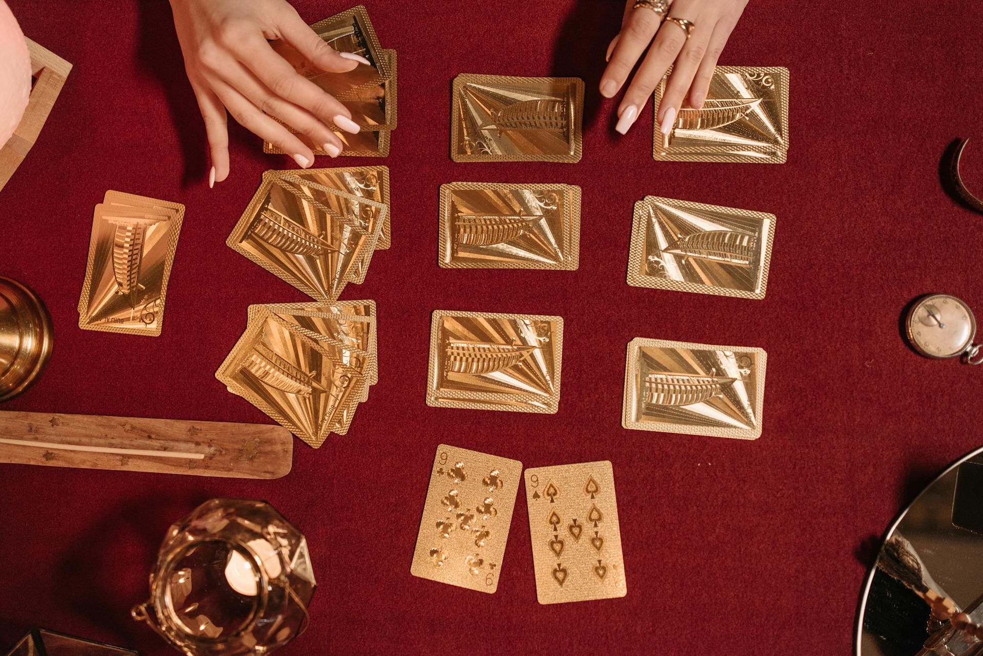 A Woman Playing with Gold Cards