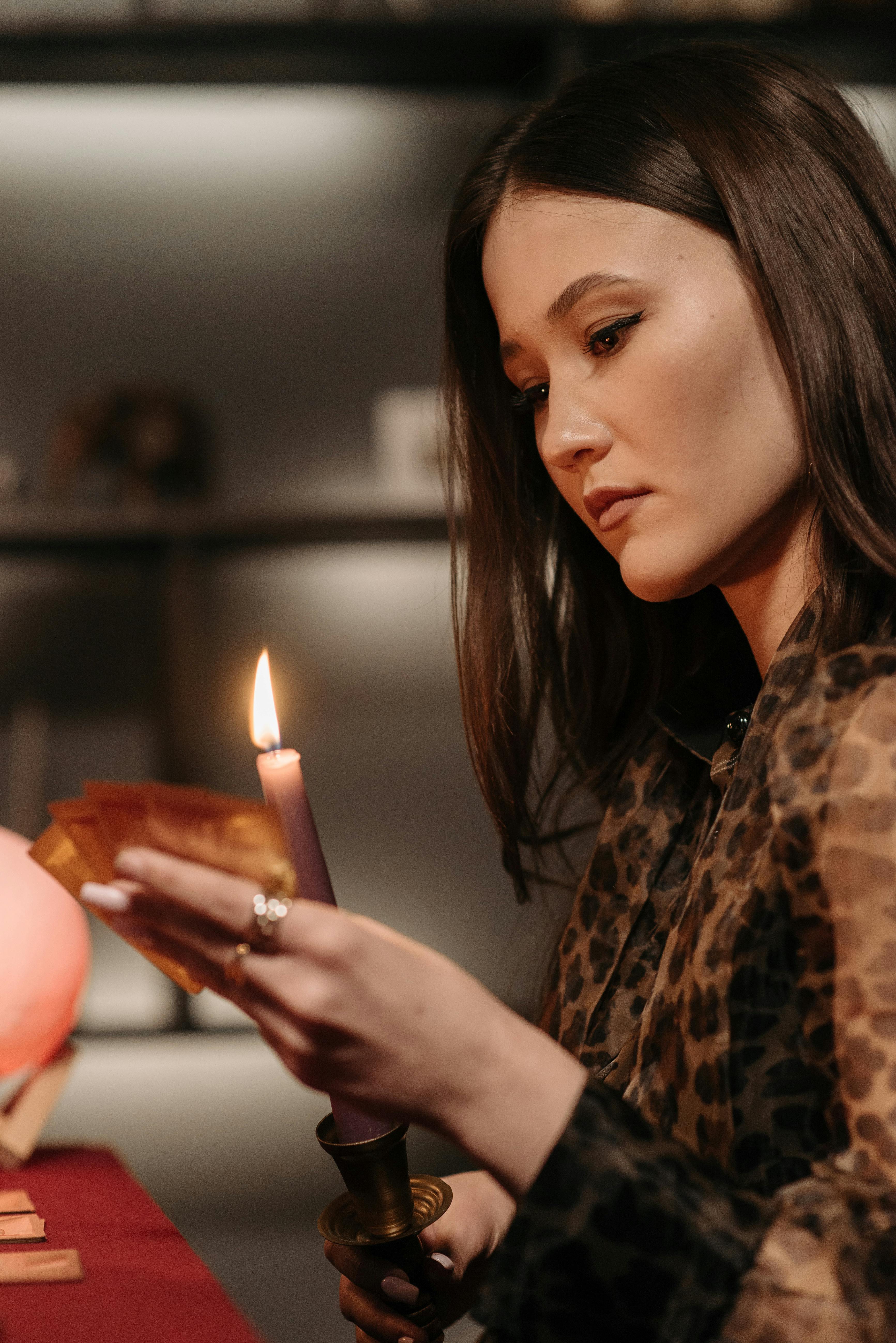 A mysterious fortune teller reading tarot cards by candlelight, adding an aura of mystery.