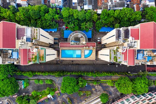 Stunning aerial shot of Jakarta showing rooftop pool and surrounding architecture.