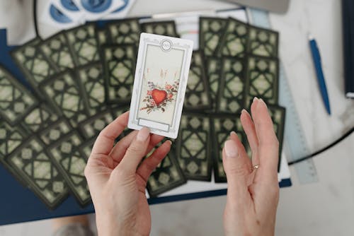 Woman Holding Tarot Card 