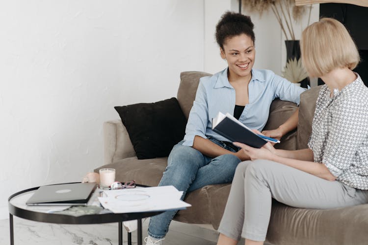 Women Sitting On A Couch