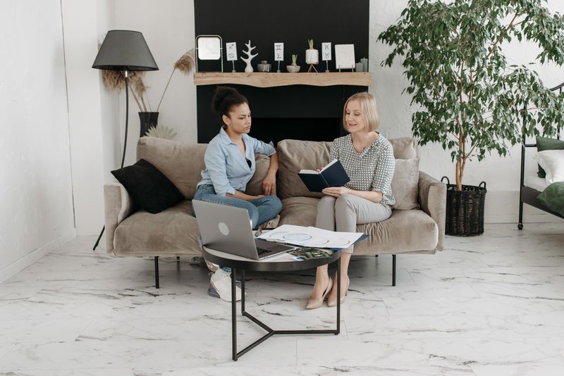 Two colleagues meeting in a bright living room, photo by Pavel Danilyuk on Pexels