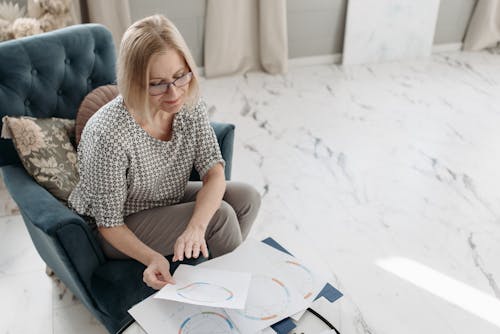 Woman Reading Horoscope in a Living Room