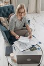 An Elderly Woman Looking at a Natal Chart