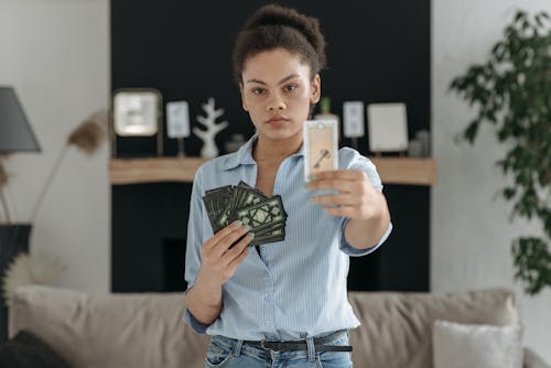 A Woman Holding a Bunch of Tarot Cards