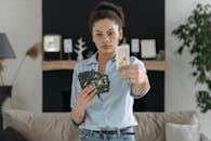 A Woman Holding a Bunch of Tarot Cards