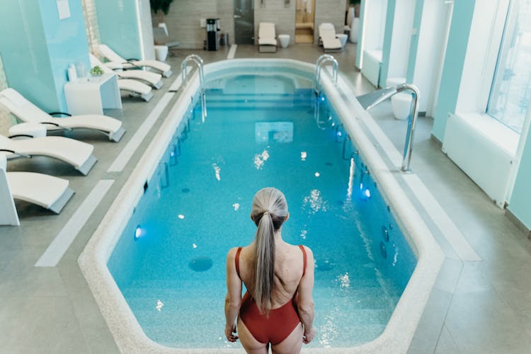 A Woman Swimming On The Pool