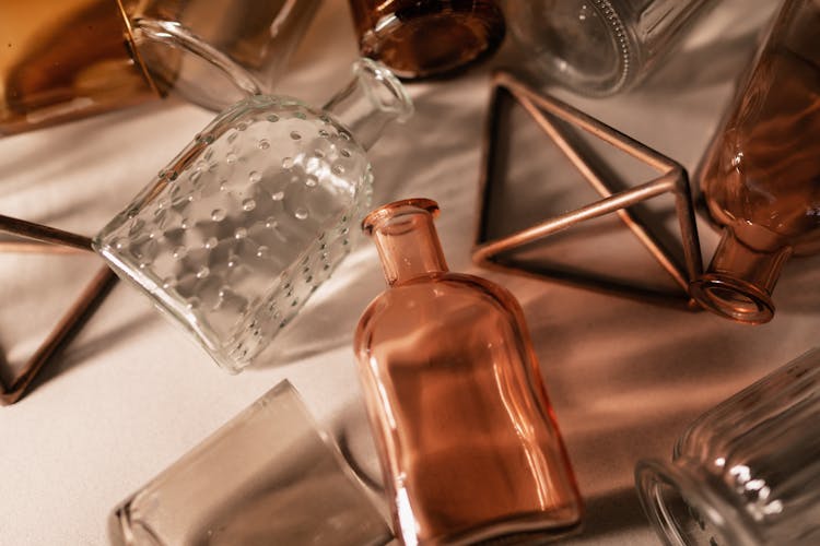 Close-Up Shot Of Empty Glass Bottles