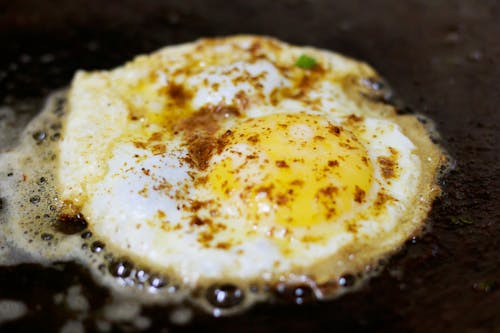 Free Fried Egg With Seasonings Stock Photo