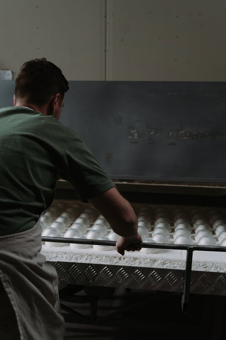 A Man Making Ceramic Bowls