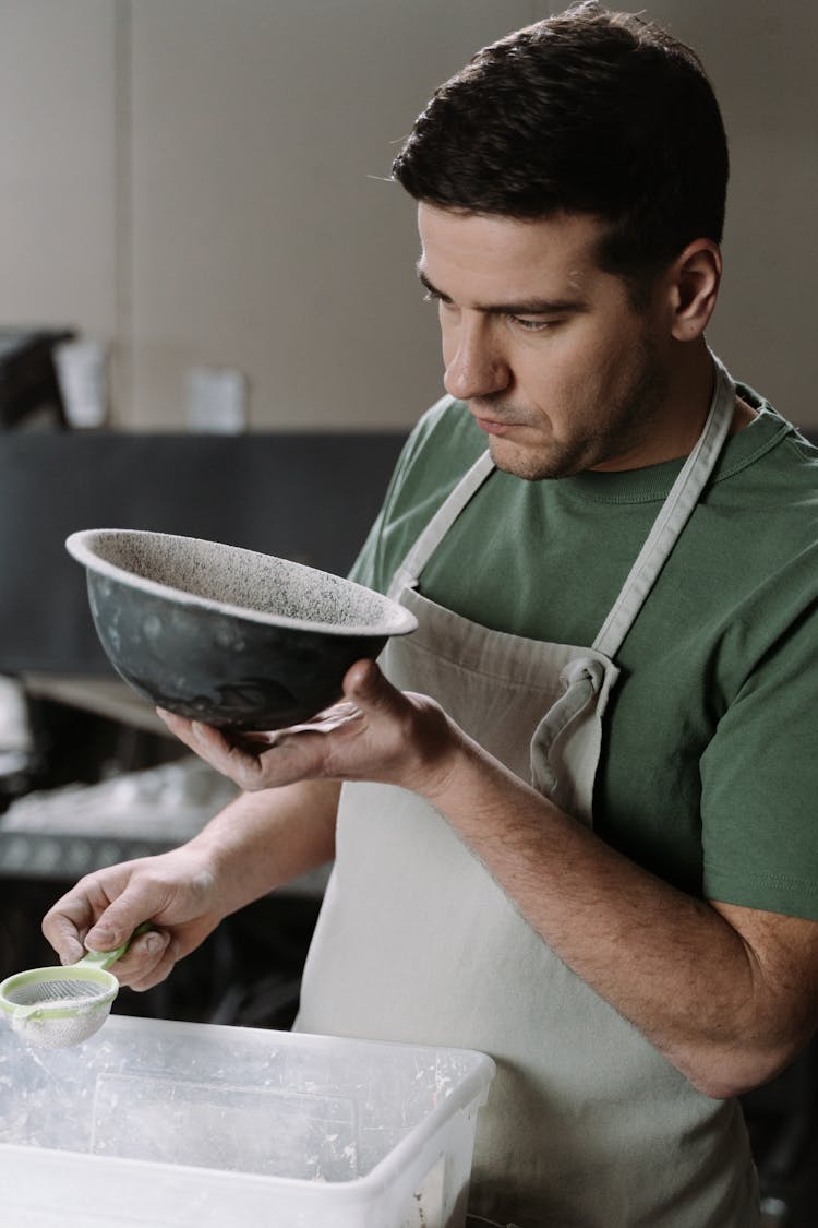 A Man Making Ceramic Bowls