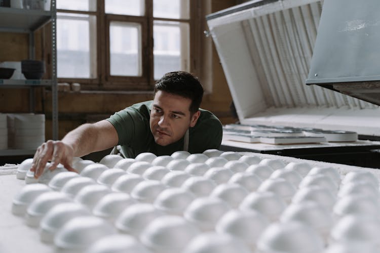 A Man Making Ceramic Bowls