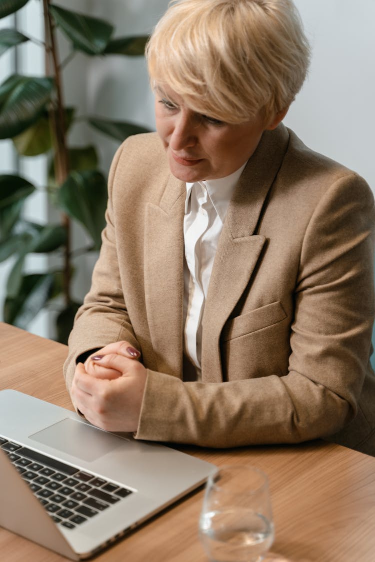 Woman In Brown Coat In The Office