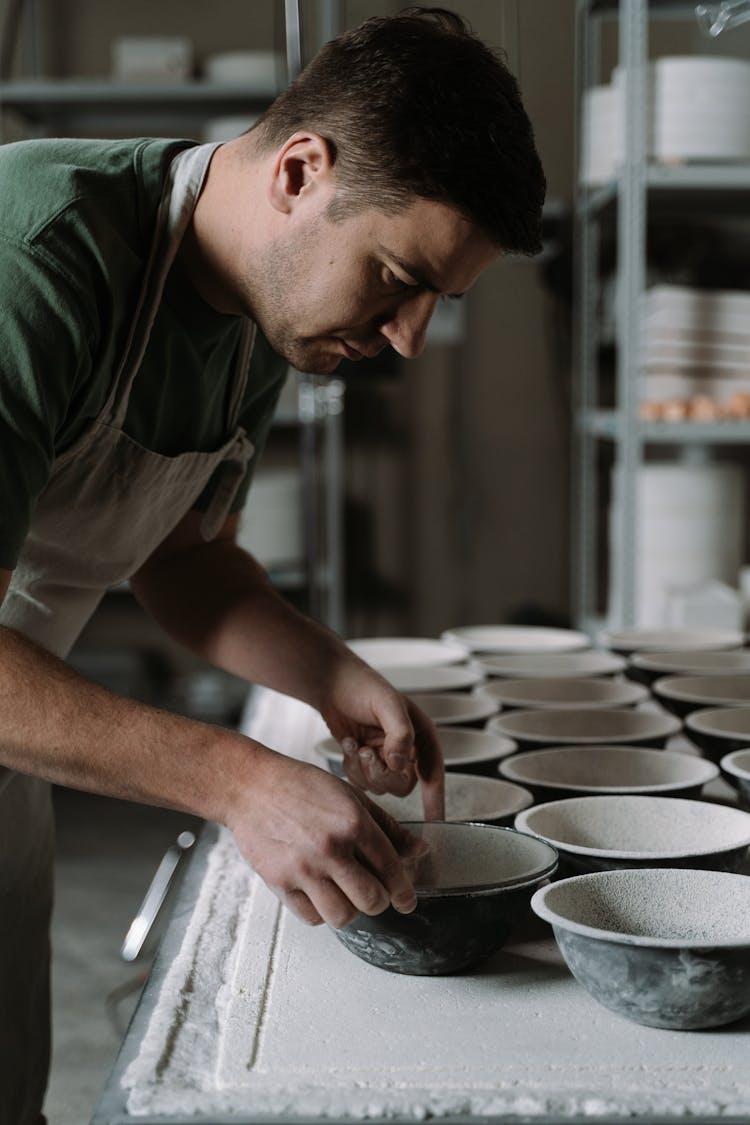 A Man Making Ceramic Bowls