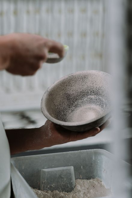 Hands crafting a ceramic bowl on the wheel — photo by cottonbro studio on Pexels