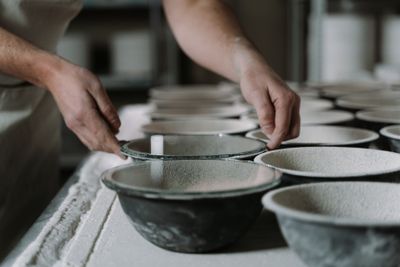 Hands finishing a bowl in a studio — photo by cottonbro studio on Pexels