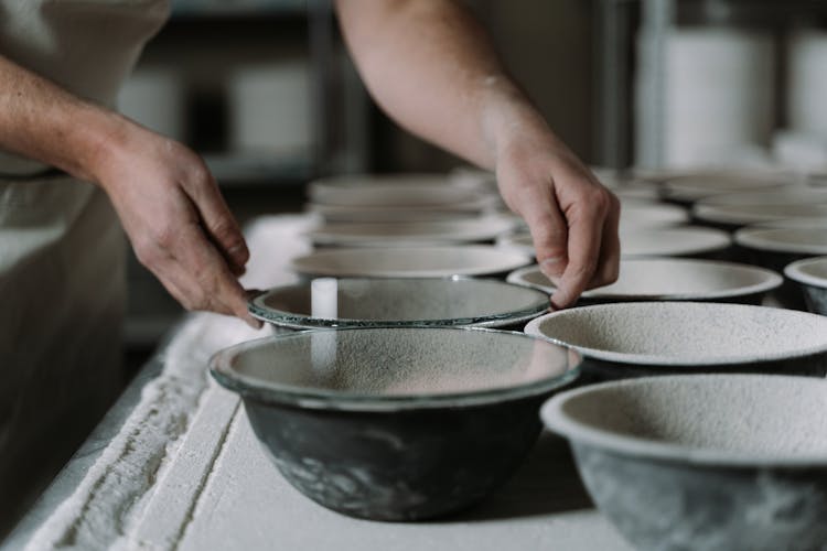 A Person Making Ceramic Bowls