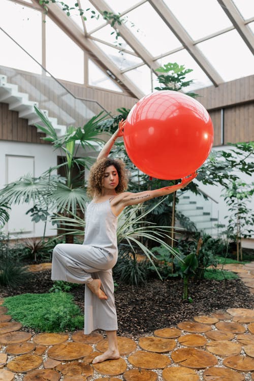 Free Woman Holding an Exercise Ball Stock Photo