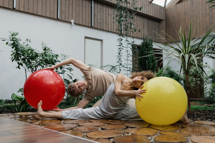 Man And Woman Exercising Together