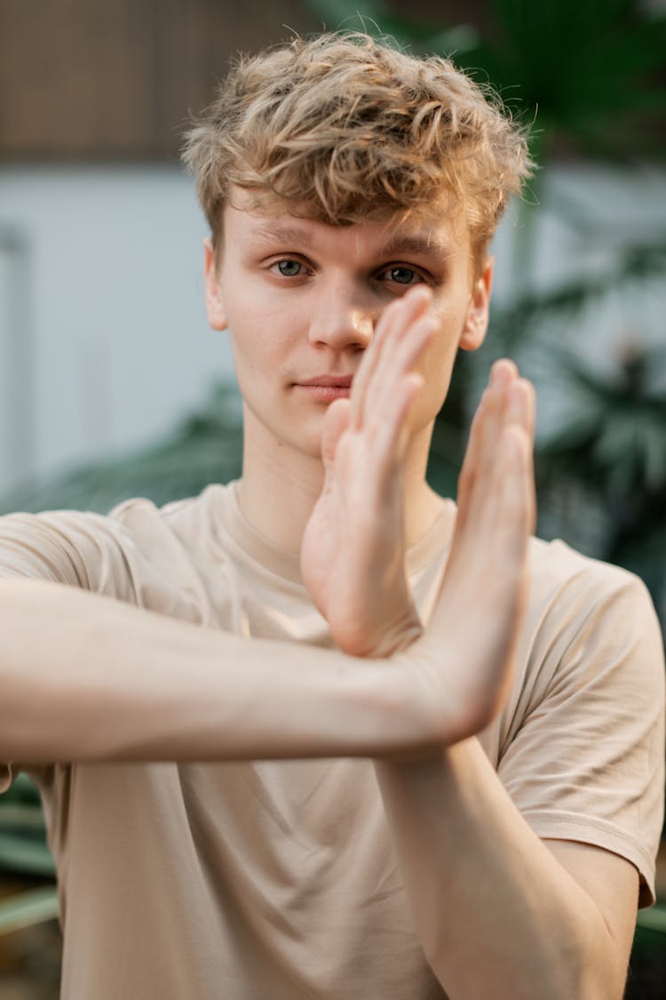 Man In Brown Shirt Posing