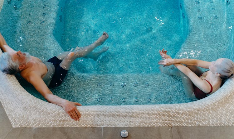 Photo Of An Elderly Couple In A Swimming Pool