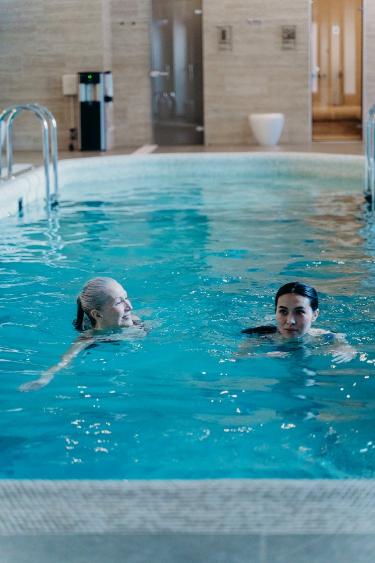 Photograph Of Women In A Swimming Pool