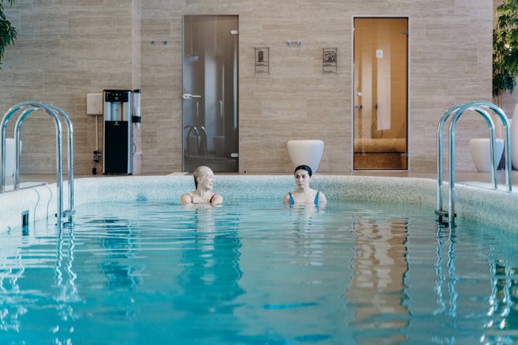 An Elderly Woman With A Young Woman In A Swimming Pool