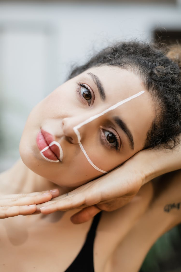 Portrait Of Woman With White Paint On Face