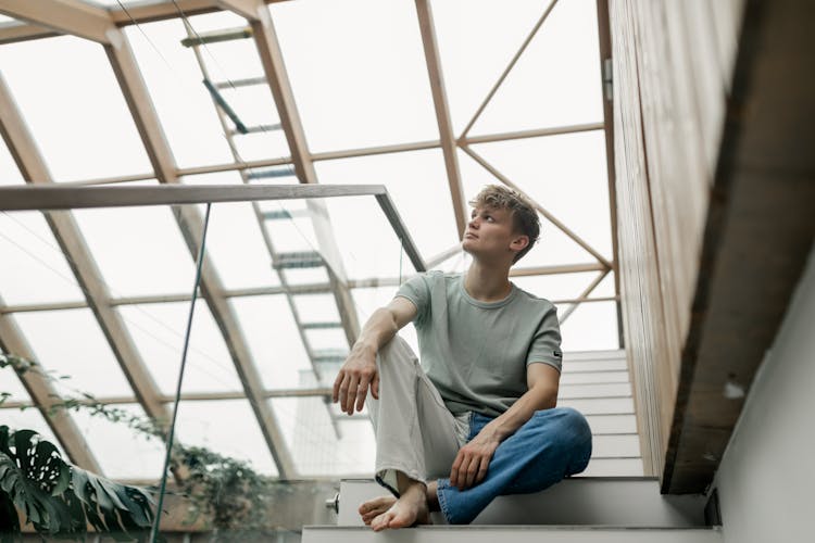 Man Sitting On The Stairs