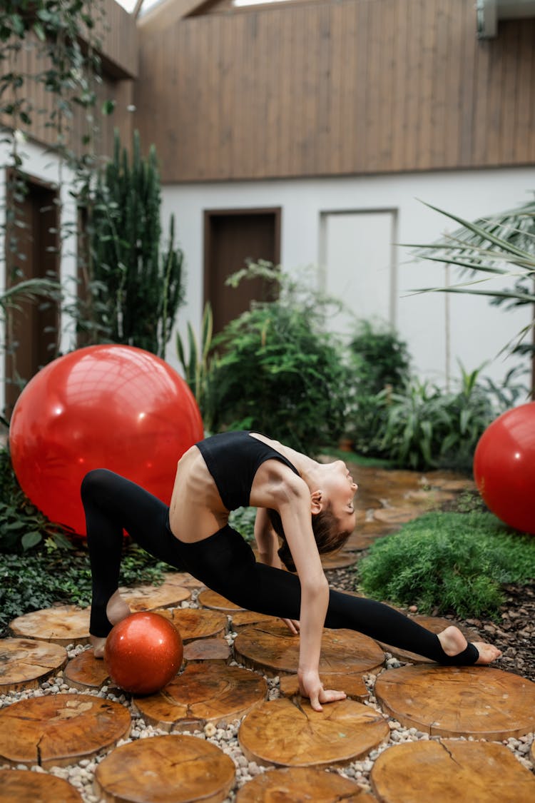 Girl Doing Gymnastics In Garden