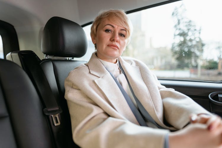 Portrait Of An Elegant Woman Sitting In A Car