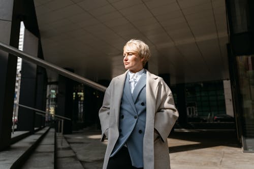 Woman Wearing Overcoat With Hands in Pockets 