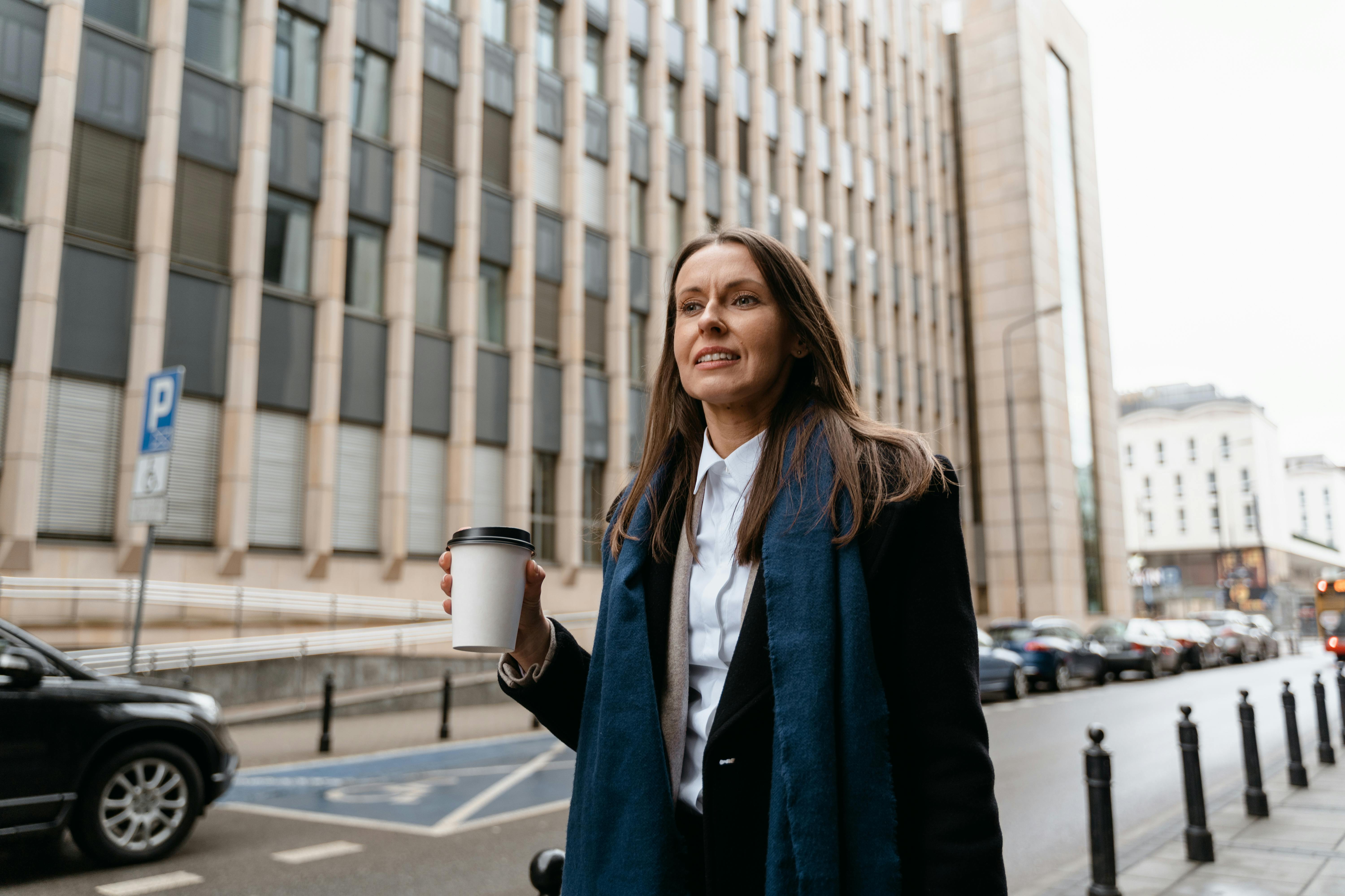 A Woman Holding a Cup of Coffee