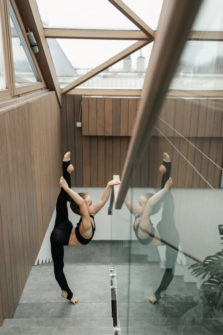 Gymnast Exercising On Stairs