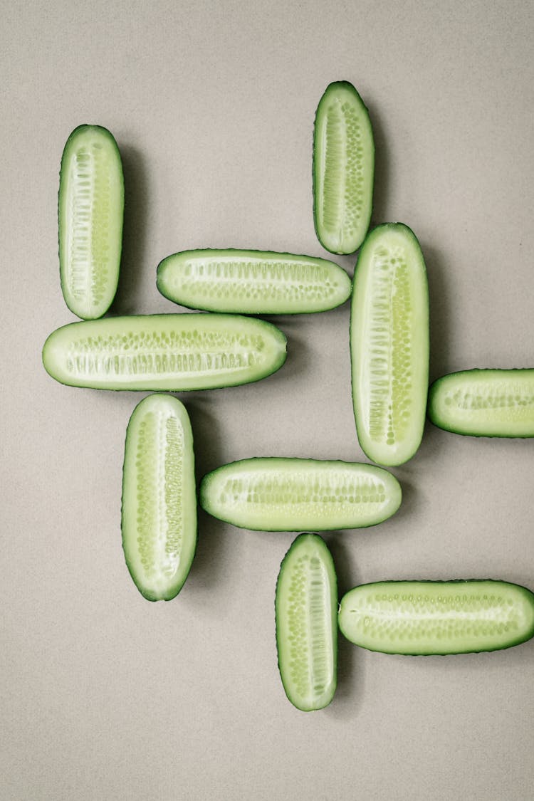 Close-up Of Cucumbers Sliced In Half And Arranged In A Geometrical Shape 