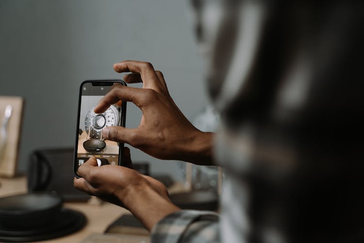 Man Hands Hands Holding Smartphone And Taking Pictures Of Metal Plate