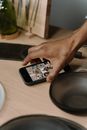 Person Holding Iphone 6 on Table
