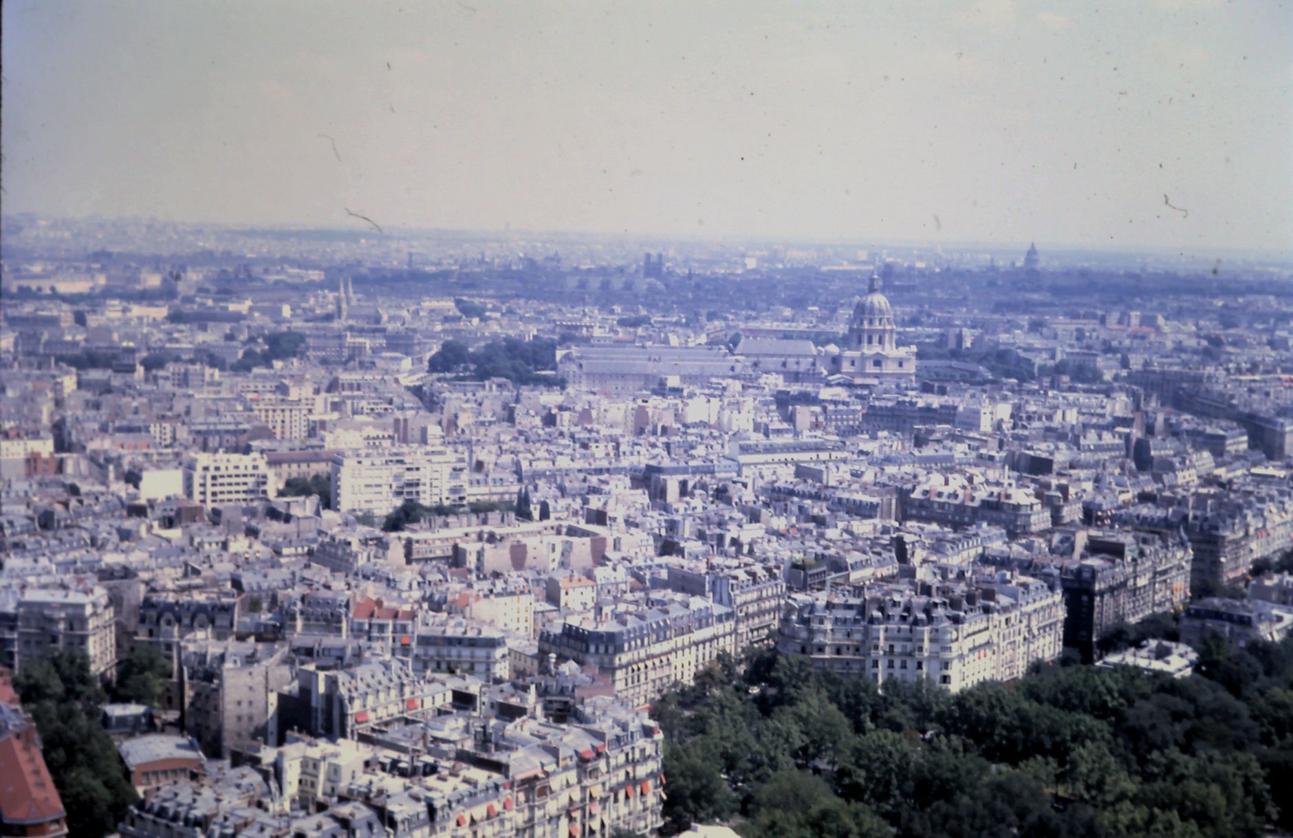 Aerial view of Paris showcasing classic architecture and expansive skyline.