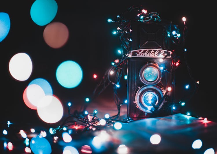 Black And Grey Lubitel 2 Camera Covered With String Lights