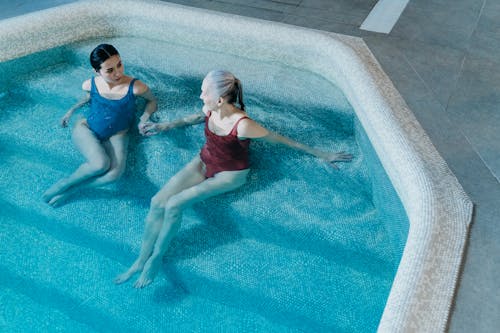 Free High-Angle Shot of Two Women in the Swimming Pool Stock Photo