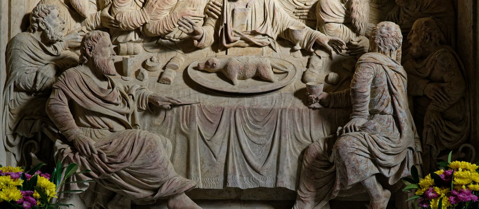 Detailed stone relief sculpture depicting The Last Supper with intricate carvings and religious symbolism.