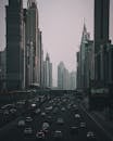Cars on Road Near High Rise Buildings