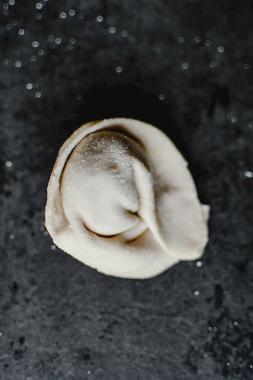 Free Dumpling Dough on Black Surface Stock Photo