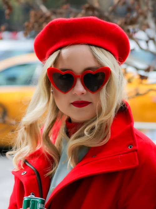 A Woman in Red Jacket Standing on the Street