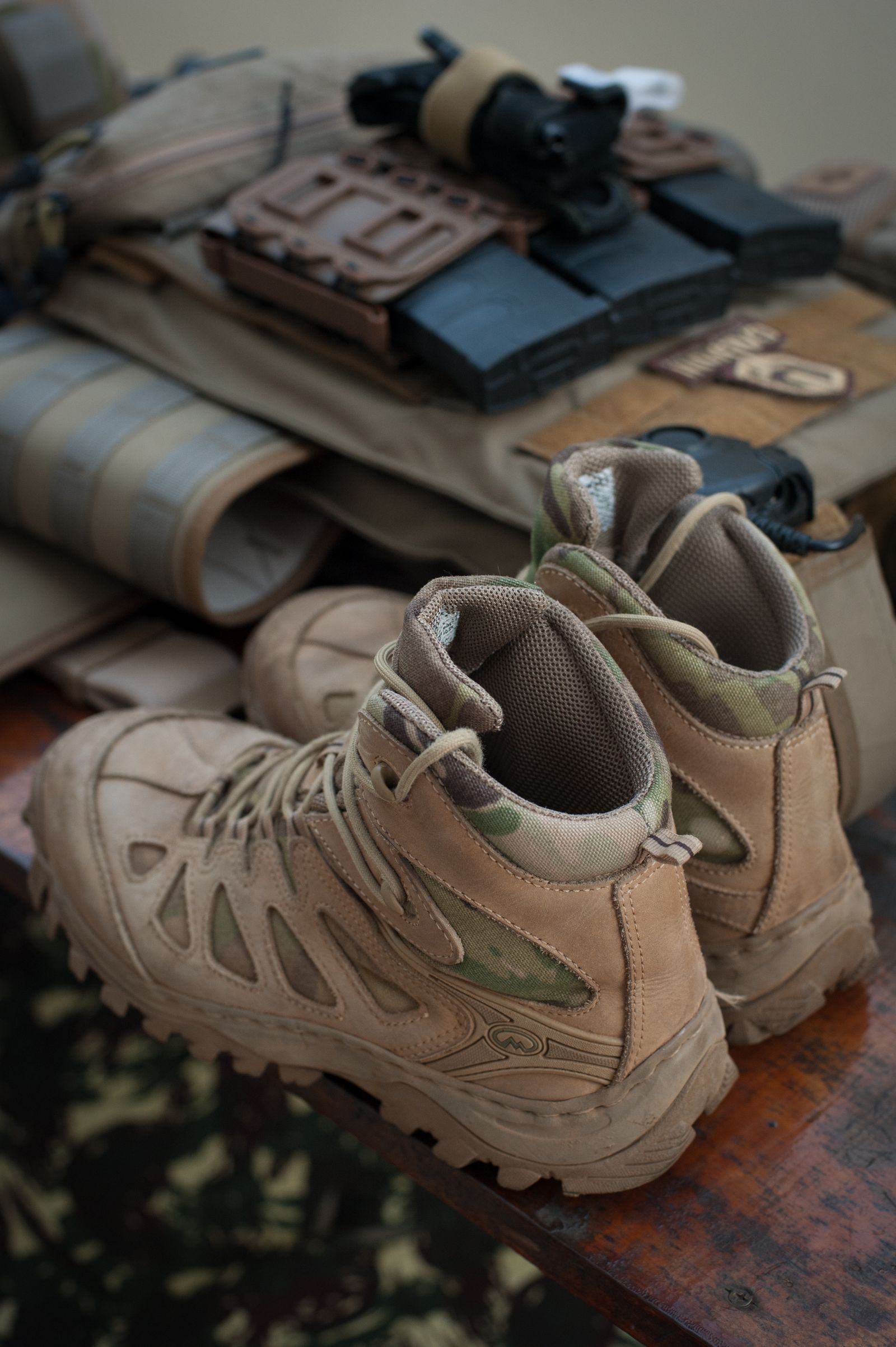 Tactical hiking boots with outdoor gear
