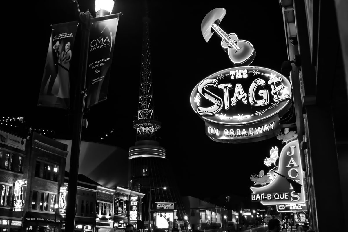 Neon-lit street scene in black and white