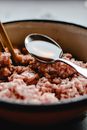 Stainless Steel Spoon on Brown Ceramic Bowl