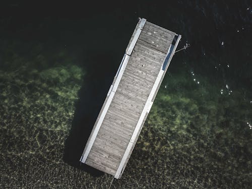 Wooden quay in calm sea in daylight