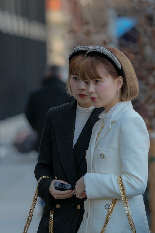 Two Women Wearing Identical Headbands