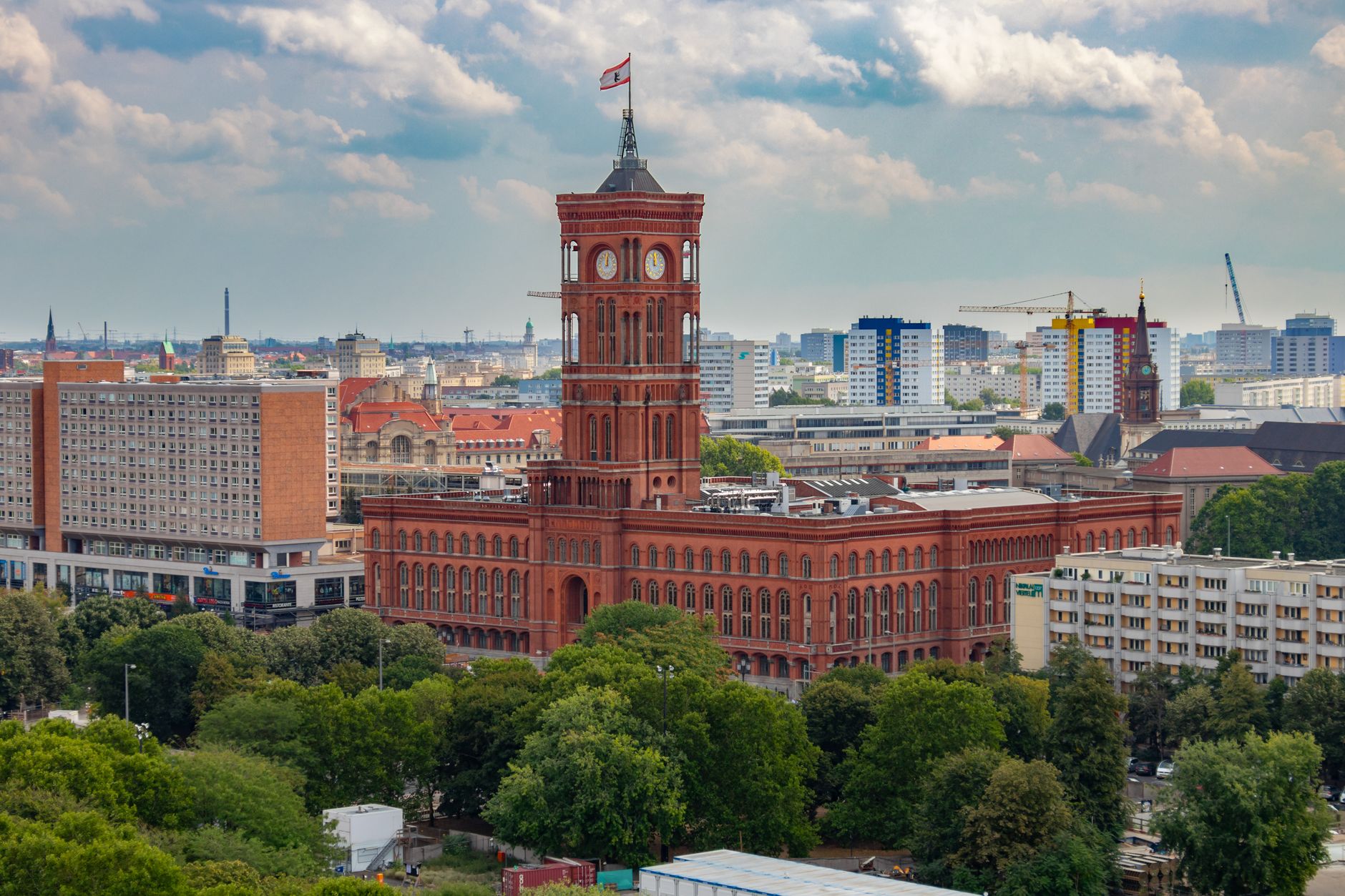 Aerial view of the historic Rotes Rathaus amidst Berlin's modern skyline.